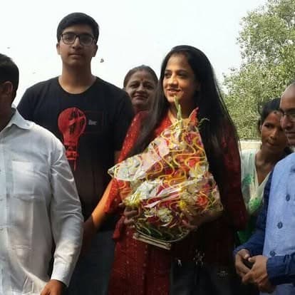 Shubhkarman volunteers with children and families at a distribution drive