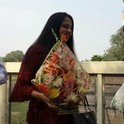 Shubhkarman volunteers with children and families at a distribution drive